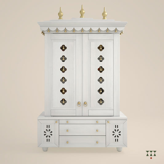 White jewelry armoire with decorative gold accents on a beige background