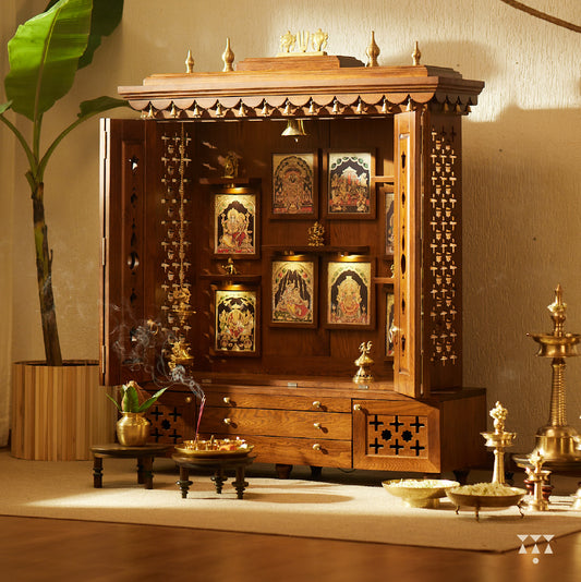 A wooden home temple with tanjore art prints of religious indian gods in almond brown color