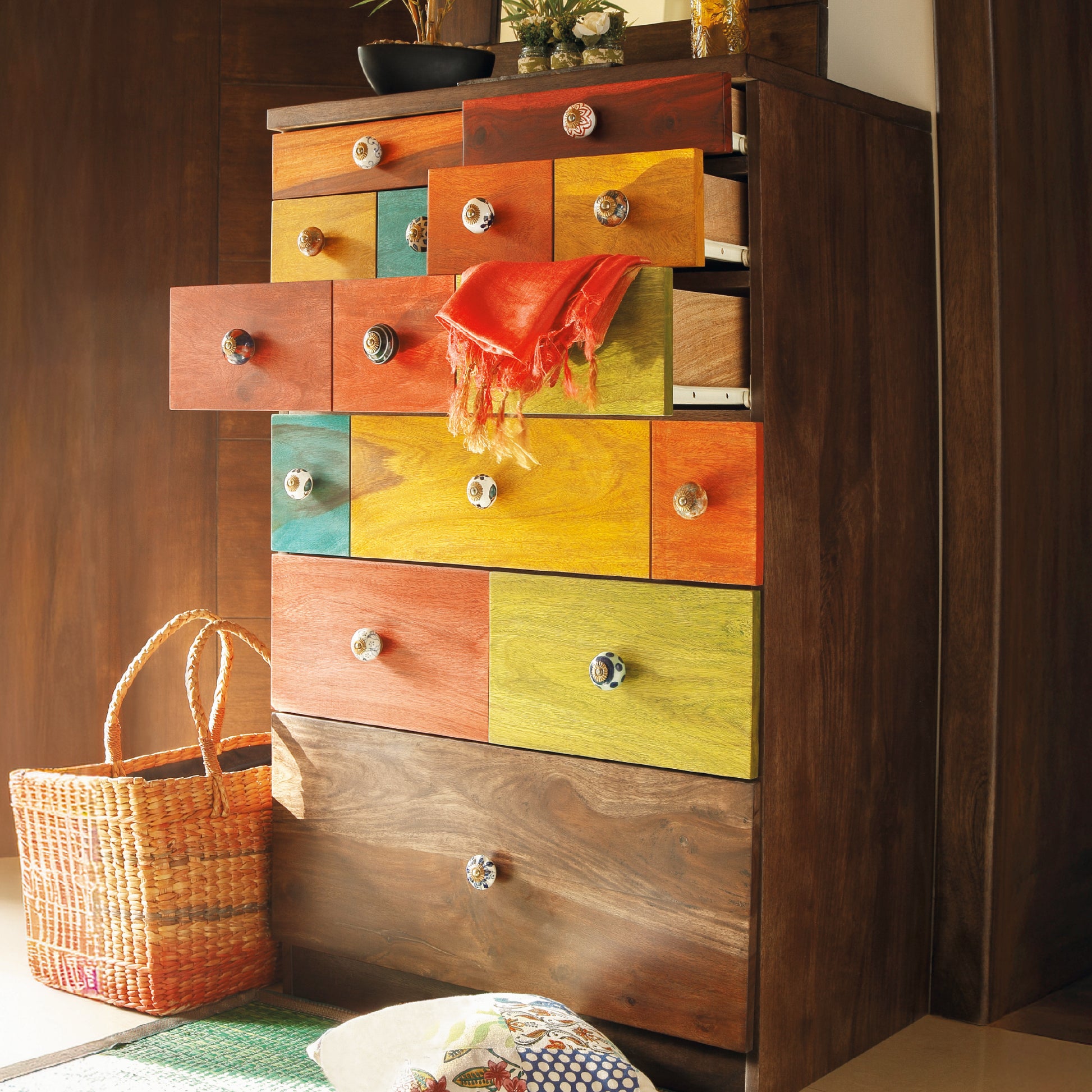 Colorful chest of drawers styled with a woven basket.
