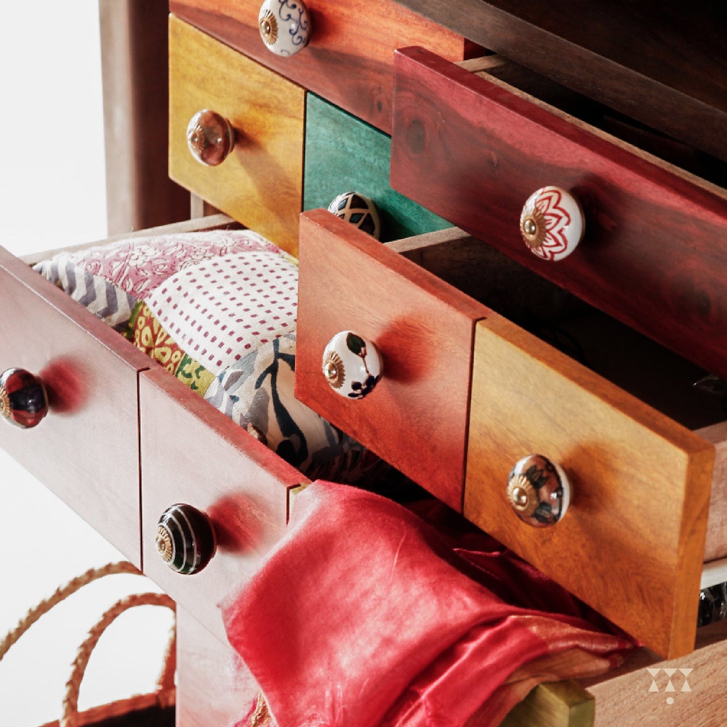 Close up of dresser drawers with ceramic knobs
