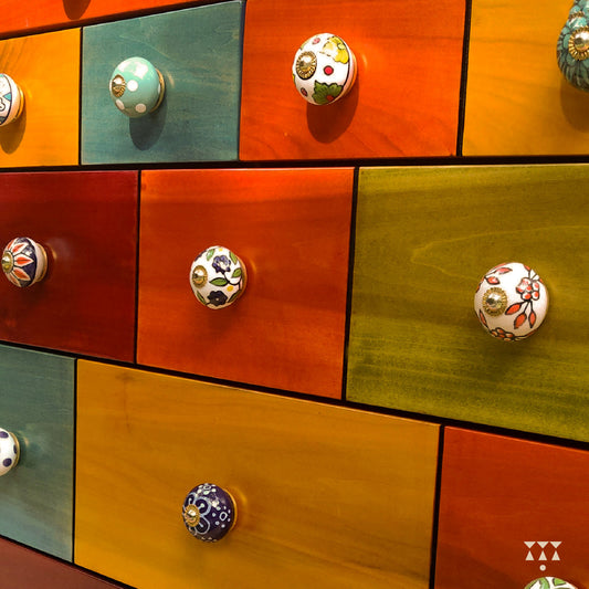 Close up of dresser drawers with handmade ceramic knobs