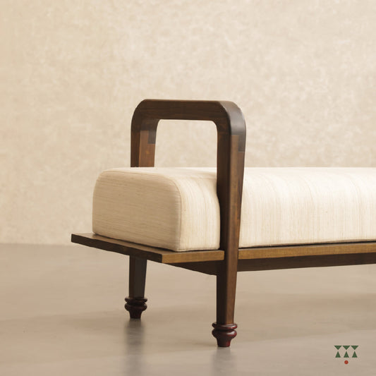 Jess, a sculpted long wooden bench