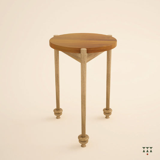 Wooden side table with a round top and elegant legs on a beige background