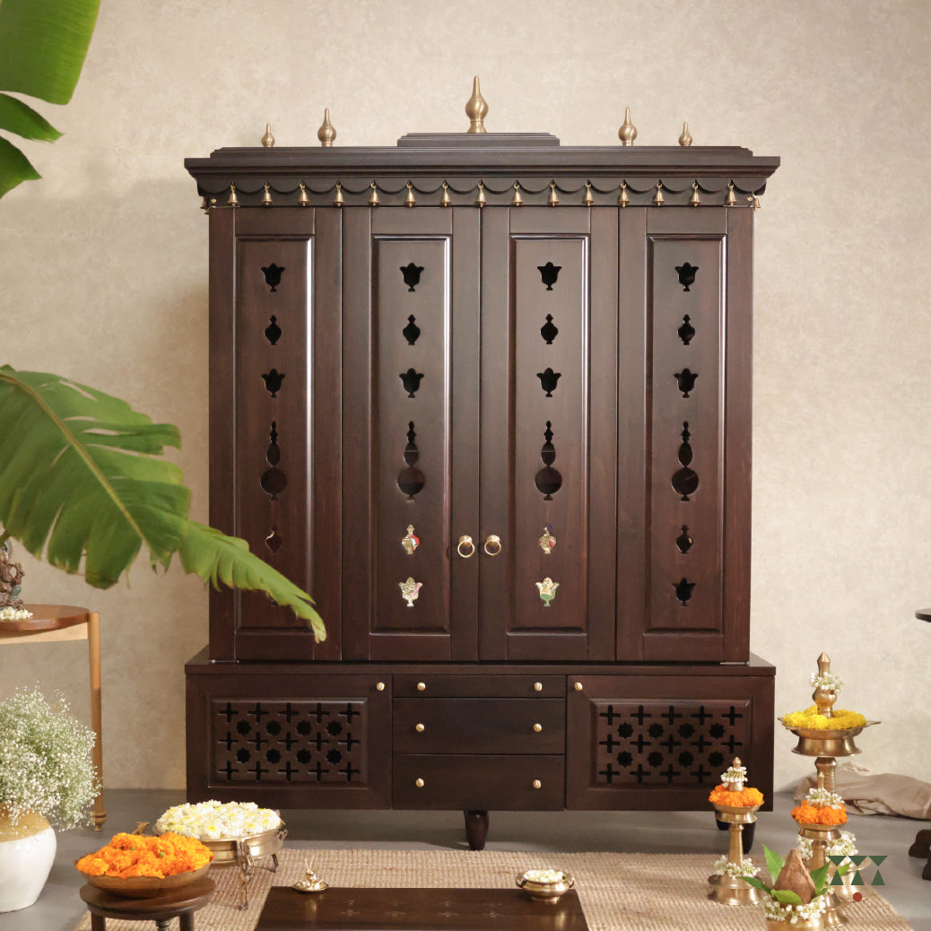 Front view of Vignaharta Temple - a decorative wooden temple with intricate carvings in a room setting.