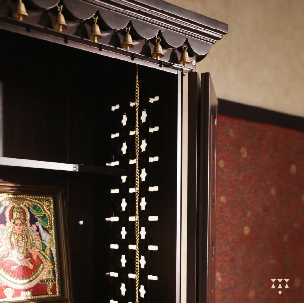 Close up of Vignaharta Wooden temple showing framed artwork and decorative elements