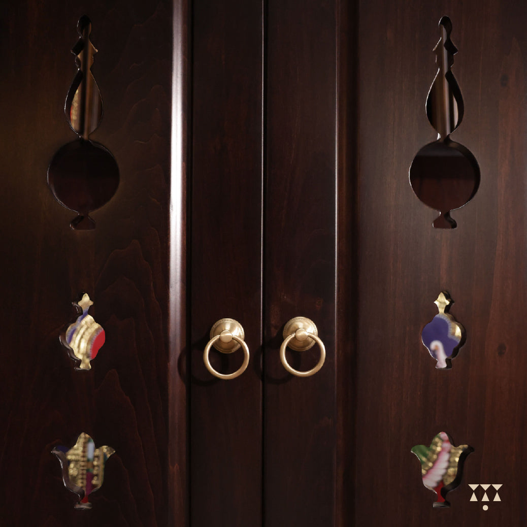Front & closeup view of Vignaharta Temple doors with decorative handles on a dark background