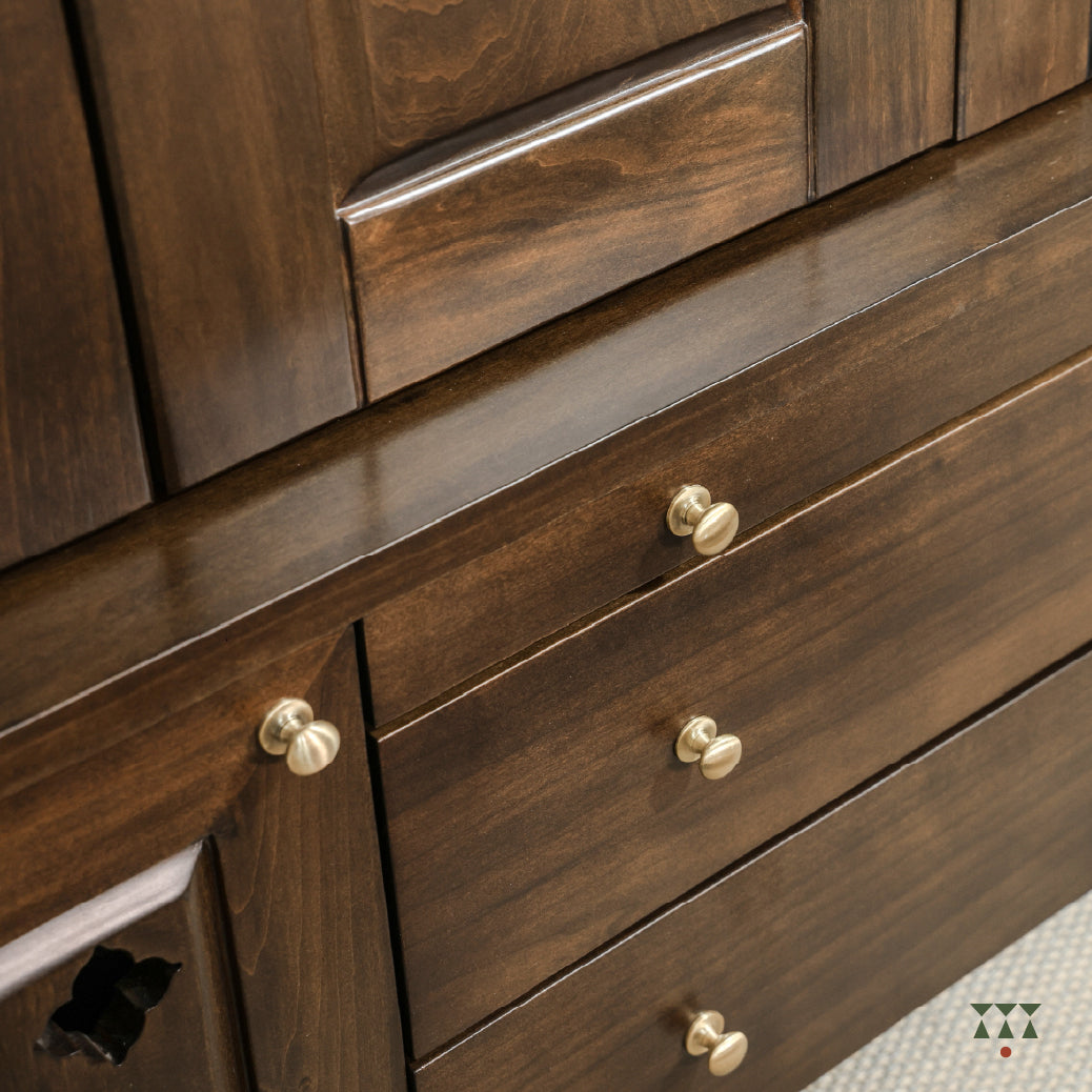 Close-up of Vikat temple storage showing the pull-out drawer with gold knobs